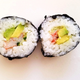 Cross-section of two pieces of California roll sushi